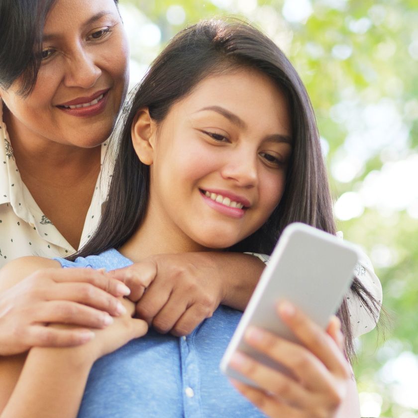 Online care recieved by a mother and daughter accessing telehealth services with their phone