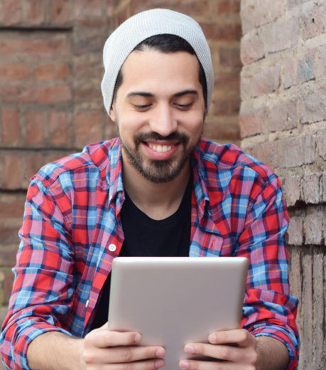 Online care recieved by a man accessing telehealth services with his tablet