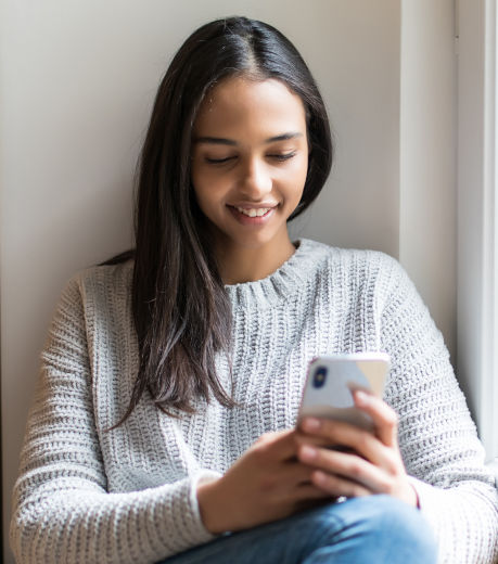Online care recieved by a woman accessing telehealth services with her phone
